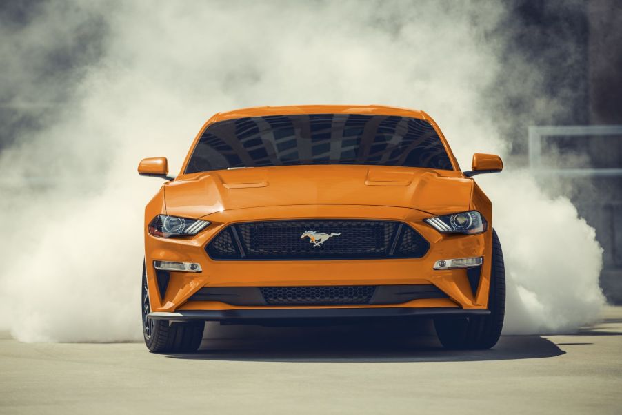 Front view of orange 2022 Ford Mustang, one of the cheapest sports cars