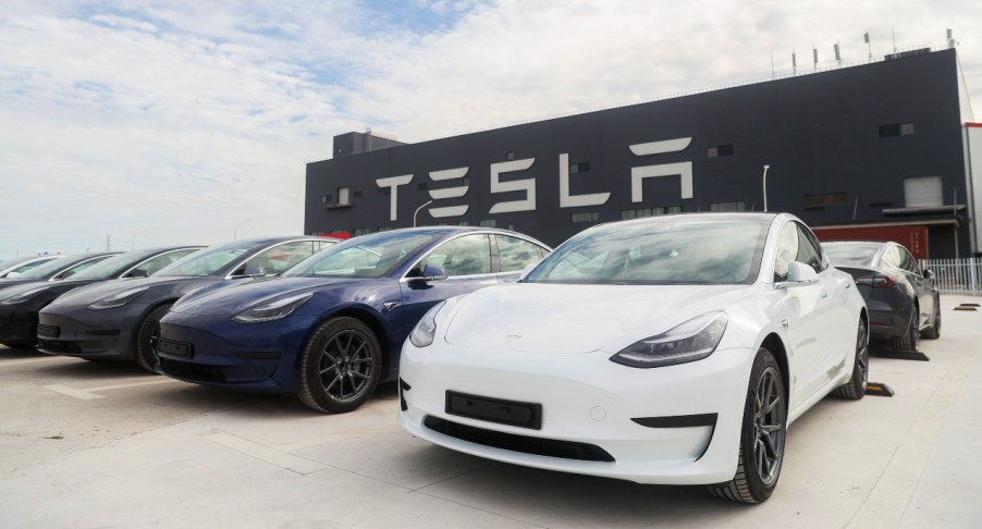 A line of Tesla Model 3 electric vehicles.