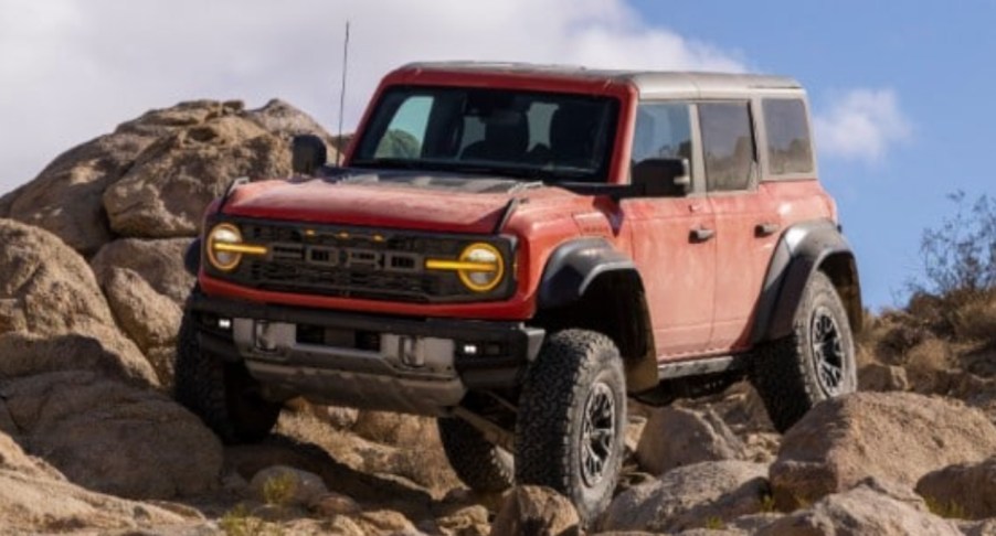 The 2022 Ford Bronco Raptor is climbing rocks.