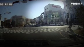 This car accident involved a taxi driving through the wall of a parking garage