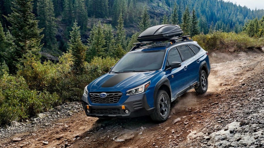 Blue 2022 Subaru Outback Wilderness on a Trail