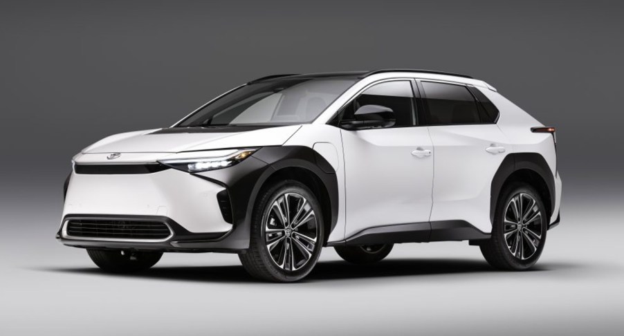 A white 2023 Toyota bZ4X electric SUV is on display.