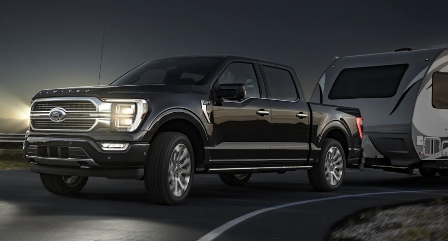 A black 2022 Ford F-150 against a night sky.