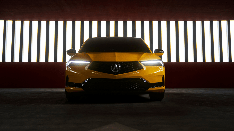 Front view of yellow 2023 Acura Integra, highlighting its release date and price