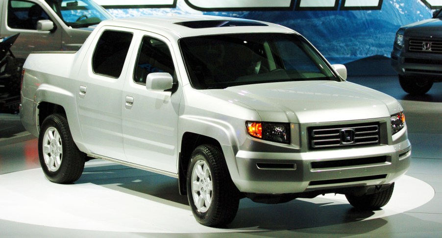 A gray Honda Ridgeline compact pickup truck.