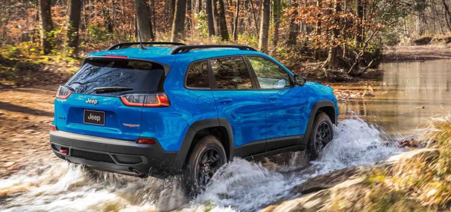 A 2022 Jeep Cherokee explores a watery road.