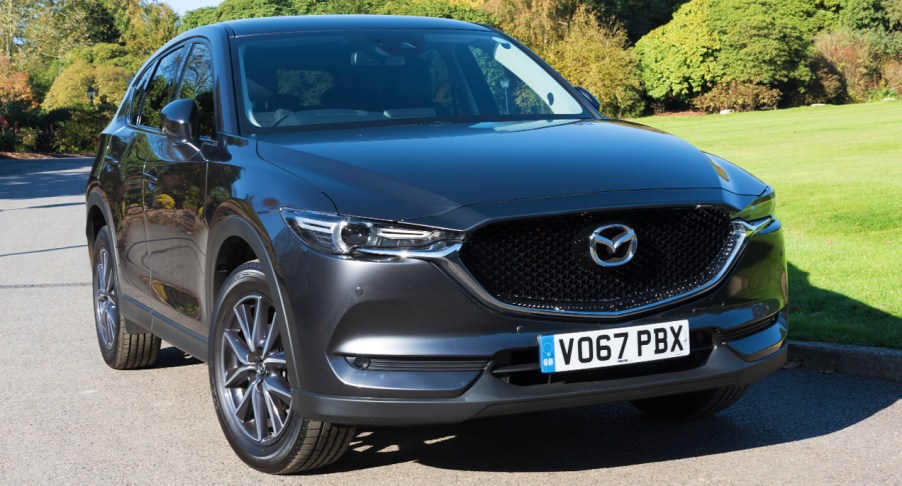 A gray Mazda CX-5 compact SUV is parked.