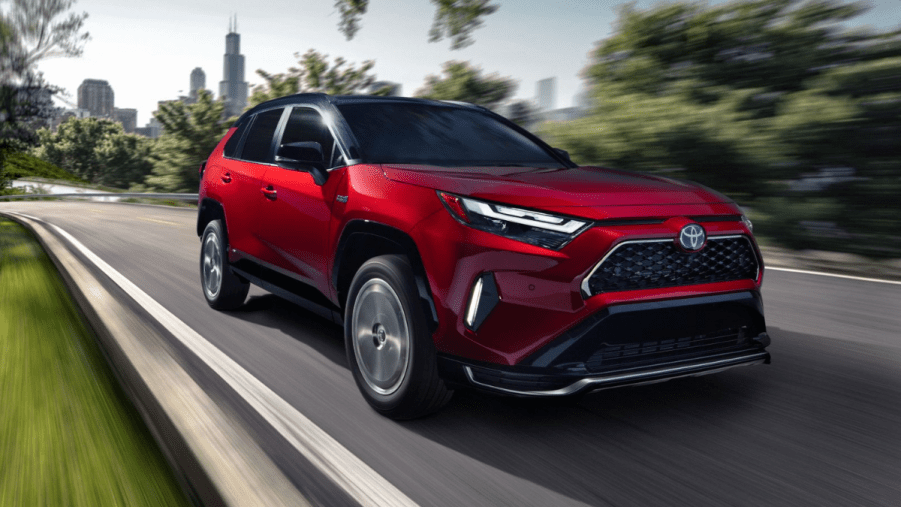 Supersonic Red 2022 Toyota RAV4 Prime with the Chicago skyline in the background