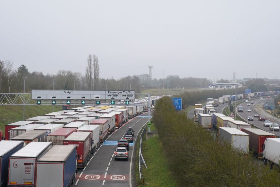 Truckers, some which work for trucking companies, driving down a crowded interstate.