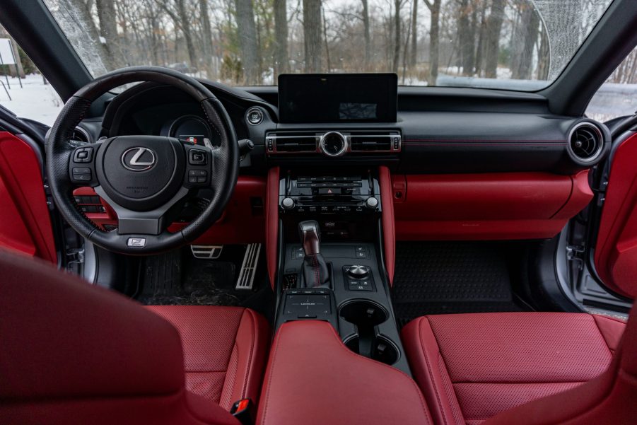 The red-and-black front seats and dashboard of a 2021 Lexus IS 350 F Sport AWD with Dynamic Handling Package