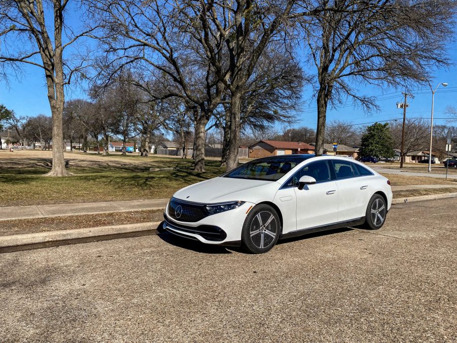 The front 3/4 view of a white 2022 Mercedes-Benz EQS 450+ Premium on a street