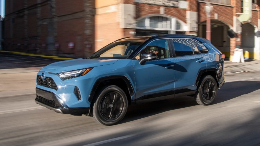 Cavalry Blue 2022 Toyota RAV4 driving on a street