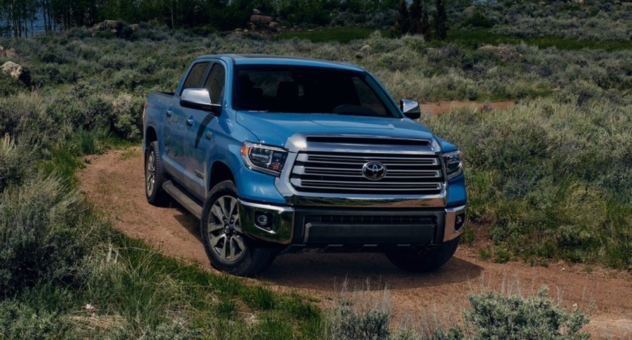 A blue 2021 Toyota Tundra is parked off-road.