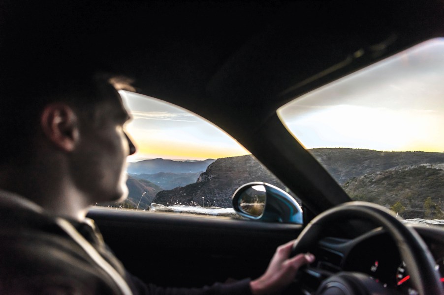 A Porsche driving doesn't wear sunglasses while driving