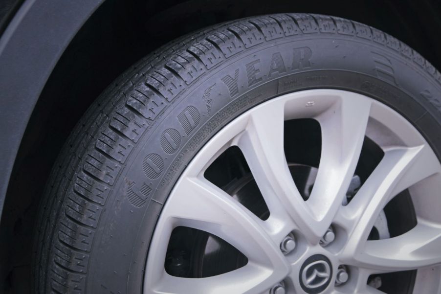 Closeup of a Goodyear tire on a Mazda car