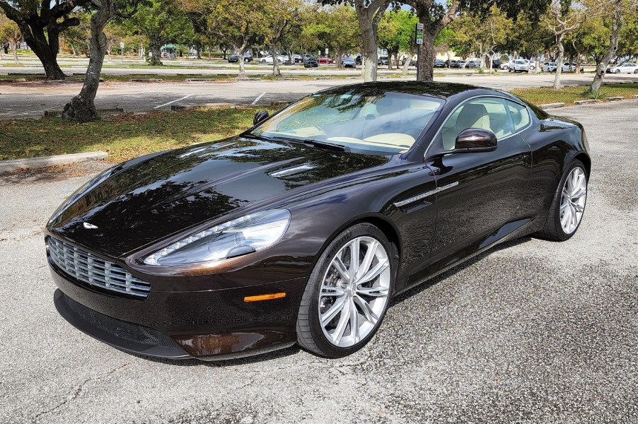 A brown 2012 Aston Martin Virage in a Florida park parking lot