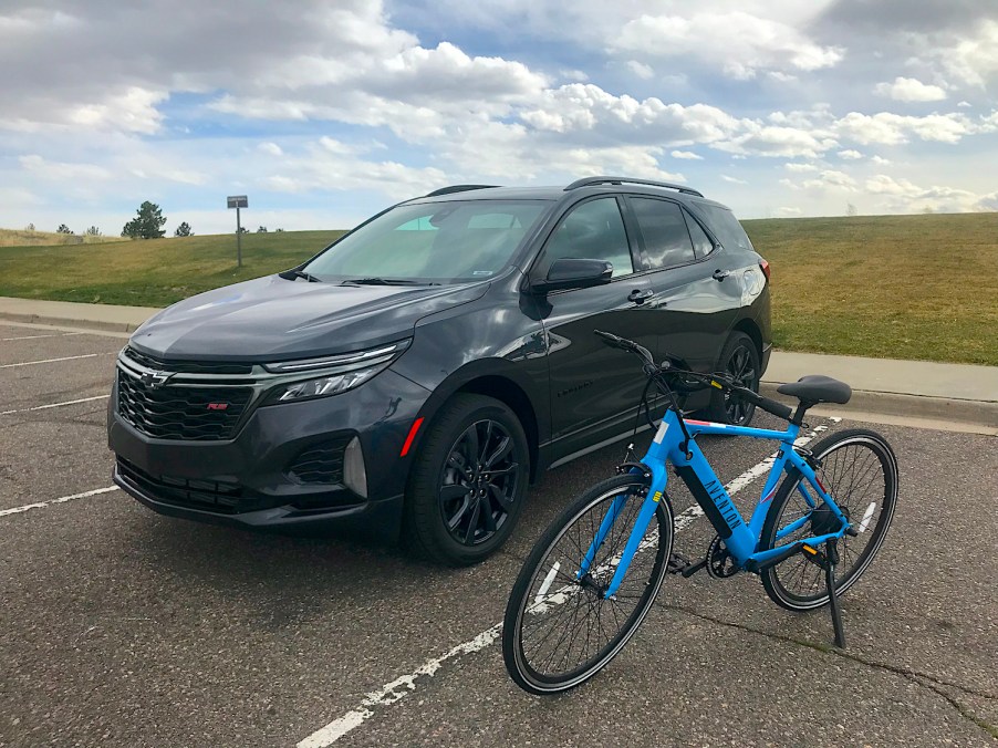 2022 Chevy Equinox with an electric bike next to it