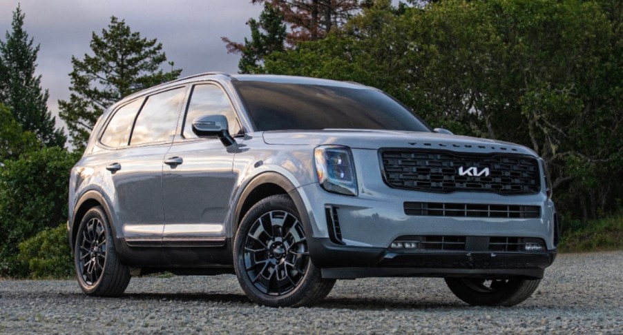 A gray 2022 Kia Telluride midsize SUV is parked outdoors.