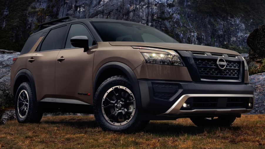 The 2023 Nissan Pathfinder Rock Creek sits in a wilderness environment, showing off its ruggedness.