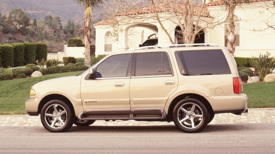 Side view of tan 1998 Lincoln Navigator, one of the most reliable used 1990s SUV that lasts many miles