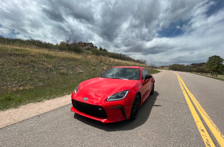 A front corner view of the 2022 Toyota GR86 on an empty road.