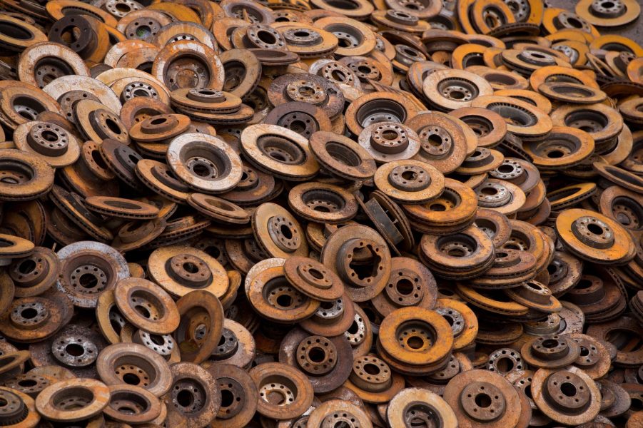 A pile of removed rusty brake rotors