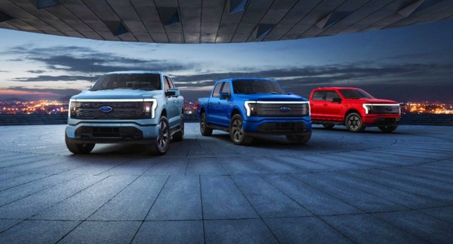 Ford F-150 Lightnings lined up in a garage