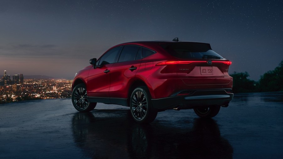 Rear angle view of red 2023 Toyota Venza, highlighting its release date and price