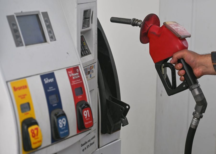 A fuel dispenser at a gas station pump concerning gas prices and fuel economy