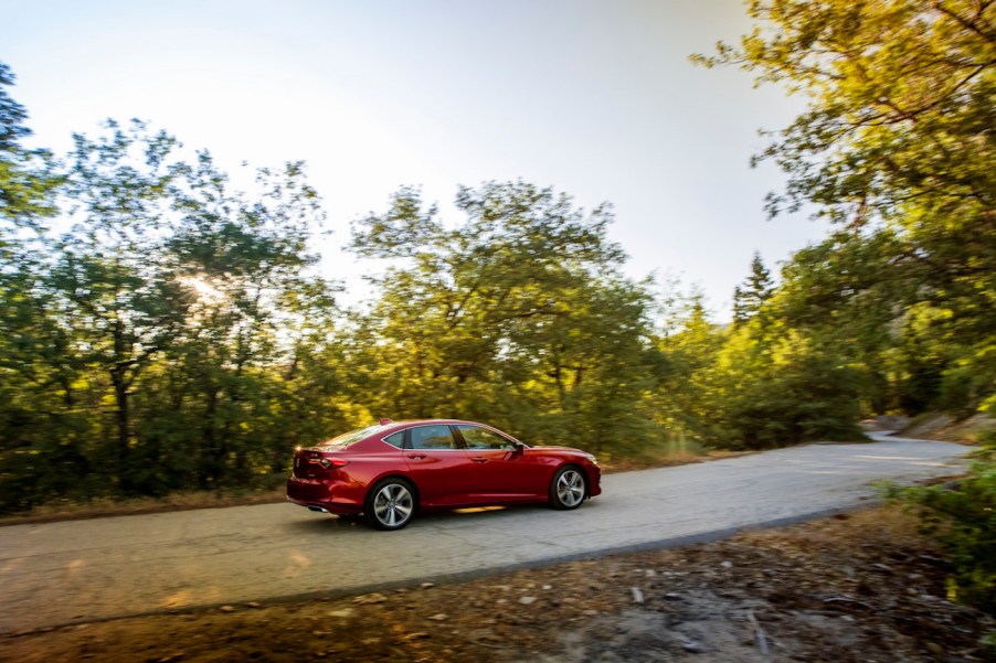 2022 TLX Advance in red driving on the street