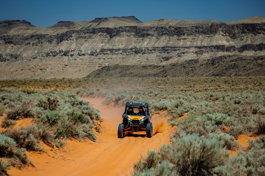 New Kawasaki UTV driving through the desert