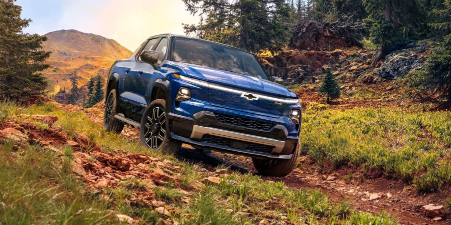 blue chevy silverado EV truck in teh woods