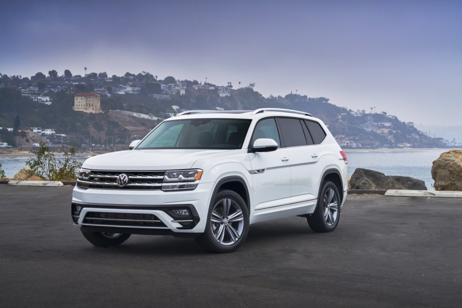 A white 2020 Volkswagen Atlas parked near water.