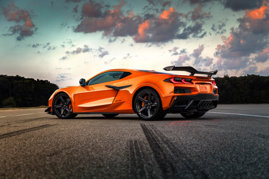 An orange 2023 Chevrolet Corvette Z06 supercar parked at dusk