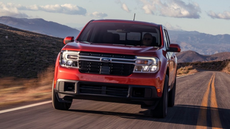 Front angle view of orange 2023 Ford Maverick pickup truck, highlighting its release date and price