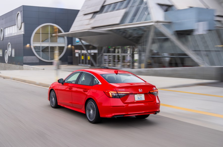 a red 2022 honda civic, a new sedan that is both efficient and fast