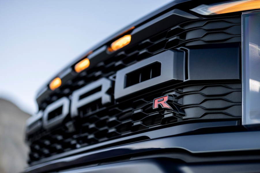 The grille of a Ford Raptor R pickup truck with amber marker lights for clearance reasons.