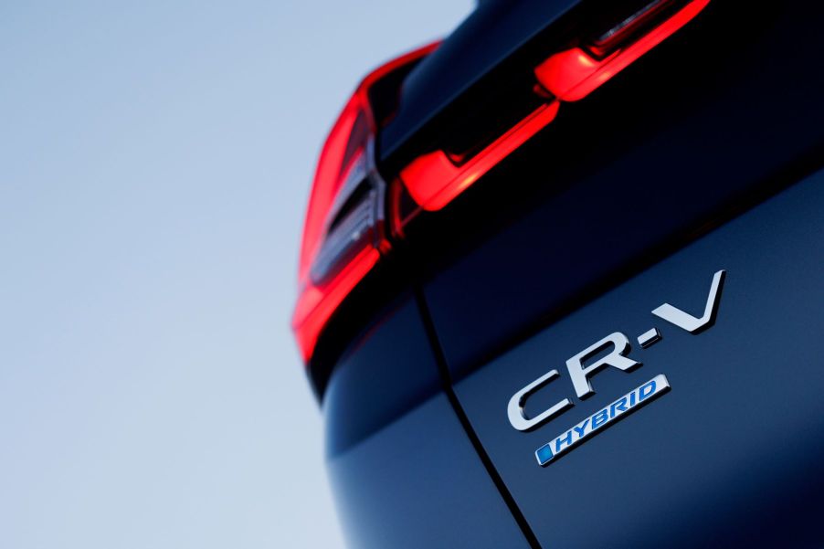 Model and trim badging on the trunk of the 2023 Honda CR-V Hybrid compact SUV model