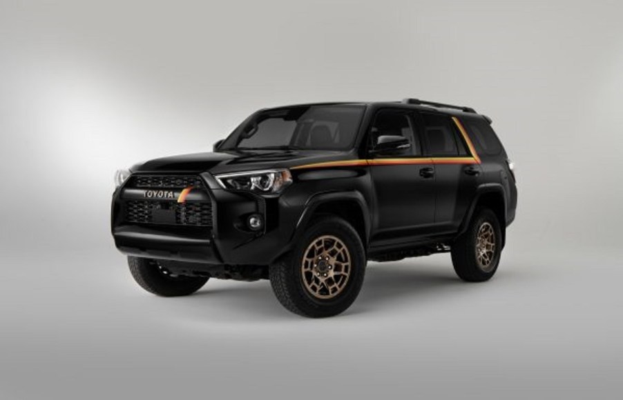 A black 2023 Toyota 4Runner with yellow and red stripes.