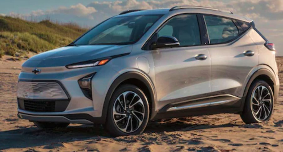 A gray 2022 Chevy Bolt EUV is parked on the sand.