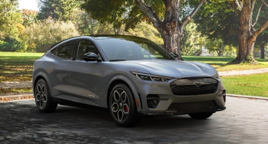 A gray 2023 Ford Mustang Mach-E electric SUV is parked.