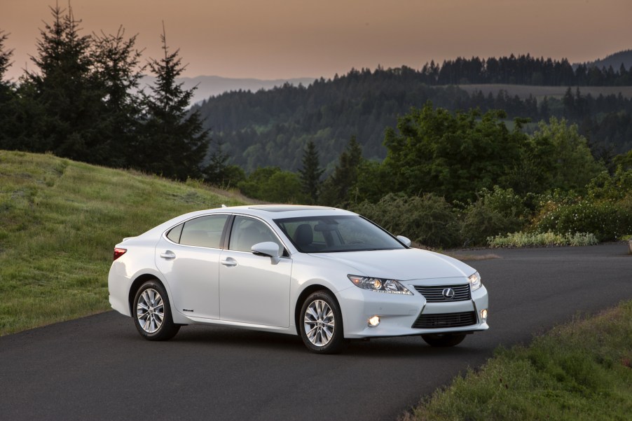 A white 2015 Lexus ES 350h hybrid sedan parked outdoors