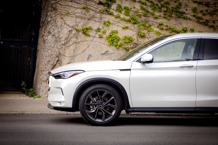 The front end of a white 2022 Infiniti QX50 outdoors.