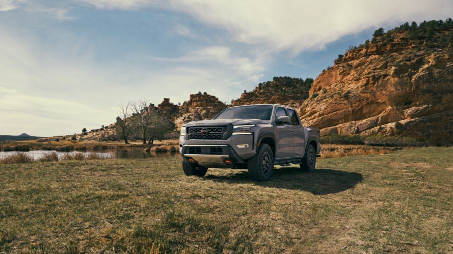 A 2023 Nissan Frontier mid-size truck sits in a field, it may have a recall.