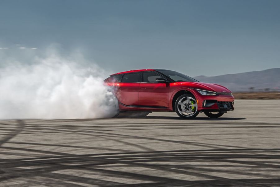 A 2023 Kia EV6 GT does a burnout on a skidpad.