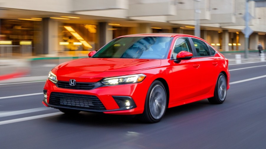 Front angle view of Rallye Red 2023 Honda Civic compact car