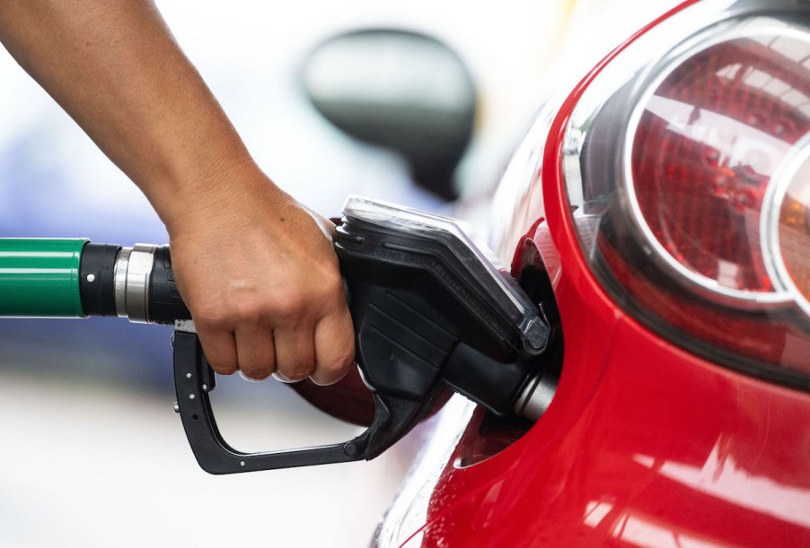 A black gas pump where they have not ban the sale of gasoline cars.