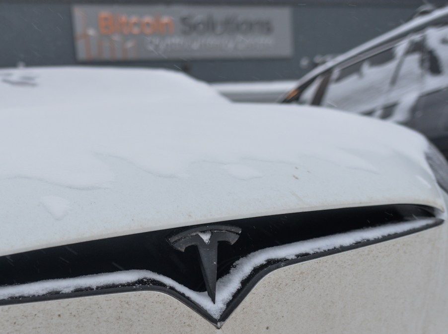 A Tesla EV outside during the winter.