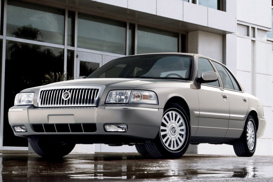 Gray 2007 Mercury Grand Marquis with a building visible in the background.