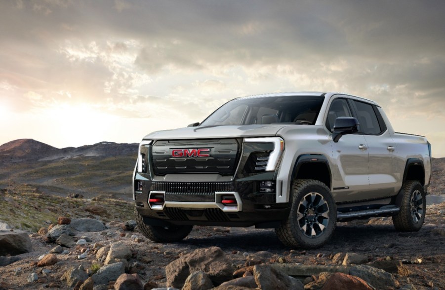 The 2025 GMC Sierra EV truck in silver on dirt